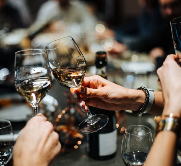 A group of friends holding their wine glasses near Mode at Hyattsville in Hyattsville, Maryland