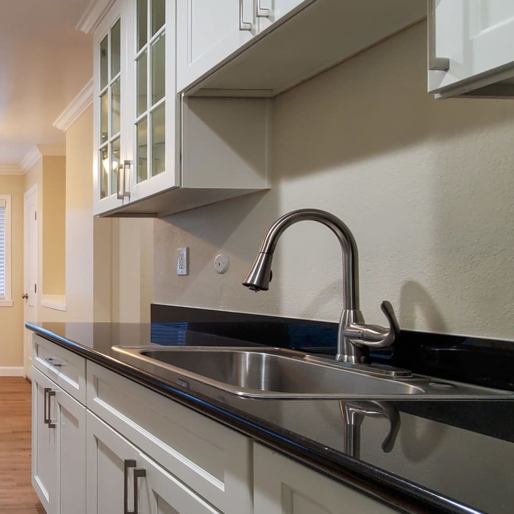 Kitchen sink with brushed nickel finish and white cabinets at our Ignacio Place community at Mission Rock at Novato in Novato, California