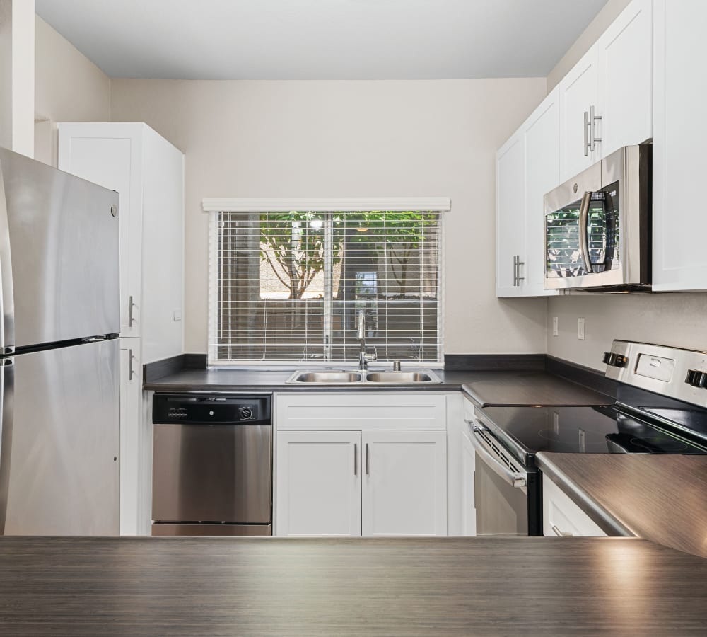Modern kitchen with stainless-steel appliances at Niguel Summit Condominium Rentals in Laguna Niguel, California