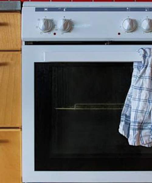 White oven with knobs and a dish towel at Zacharys Crossing in Washington Court House, Ohio