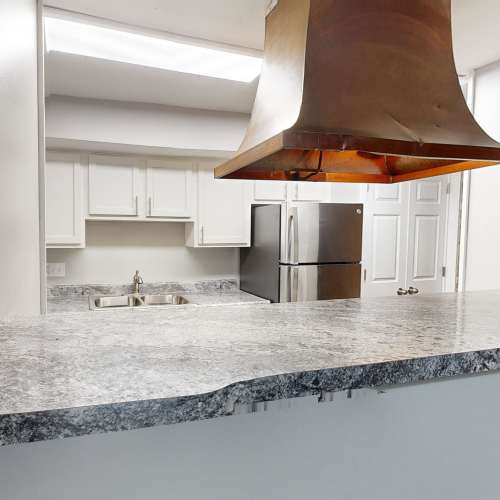 Kitchen with island at Thirty43 by the Greene in Kettering, Ohio