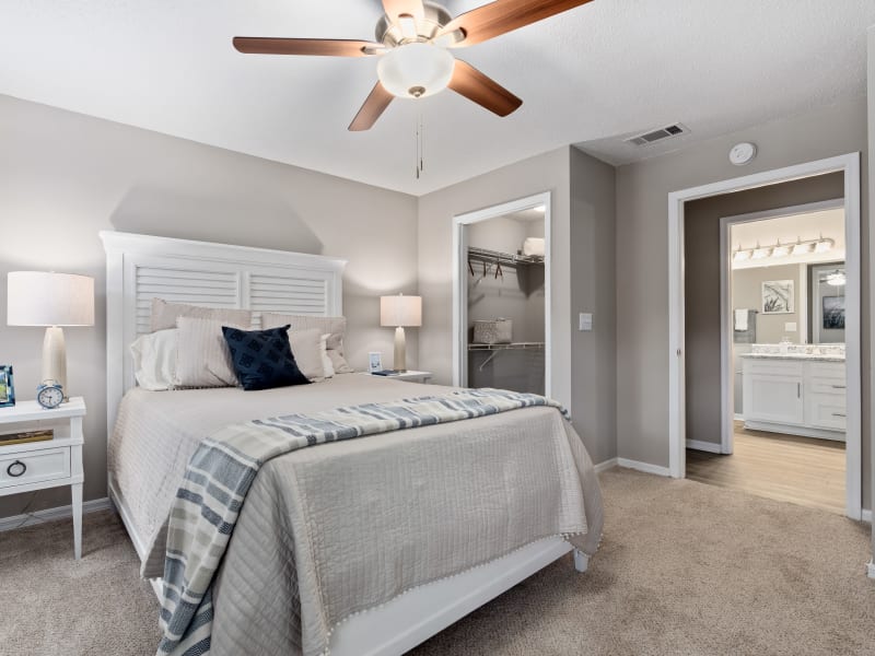 Spacious queen size bed in an apartment bedroom at Arbor Gates in Fairhope, Alabama