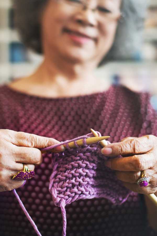 Resident crocheting at Merrill Gardens at Rolling Hills Estates in Rolling Hills Estates, California