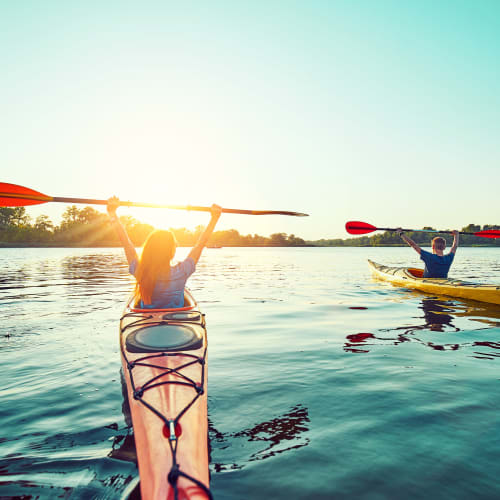 Residents kayaking near Lake Pointe Apartments in Folsom, California