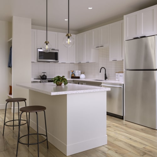 An open kitchen with an island in an apartment at Mosby Bridge Street in Huntsville, Alabama