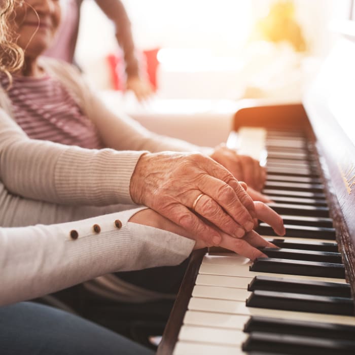 A resident participating in a music program at Milestone Senior Living Rhinelander in Rhinelander, Wisconsin