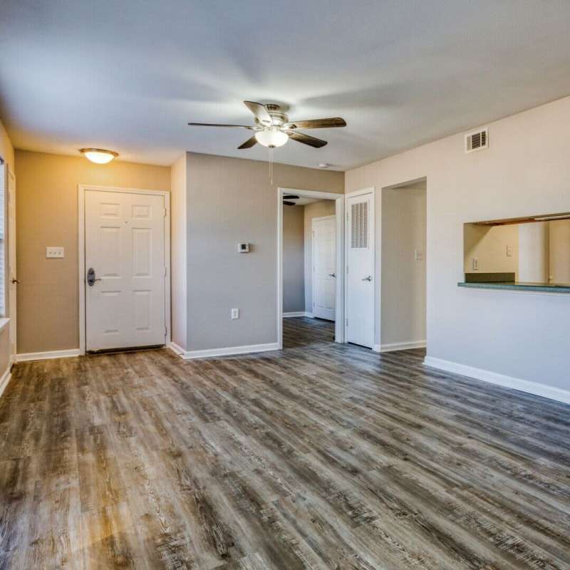 Unfurnished living room with windows at Boomer Creek Apartments in Stillwater, Oklahoma