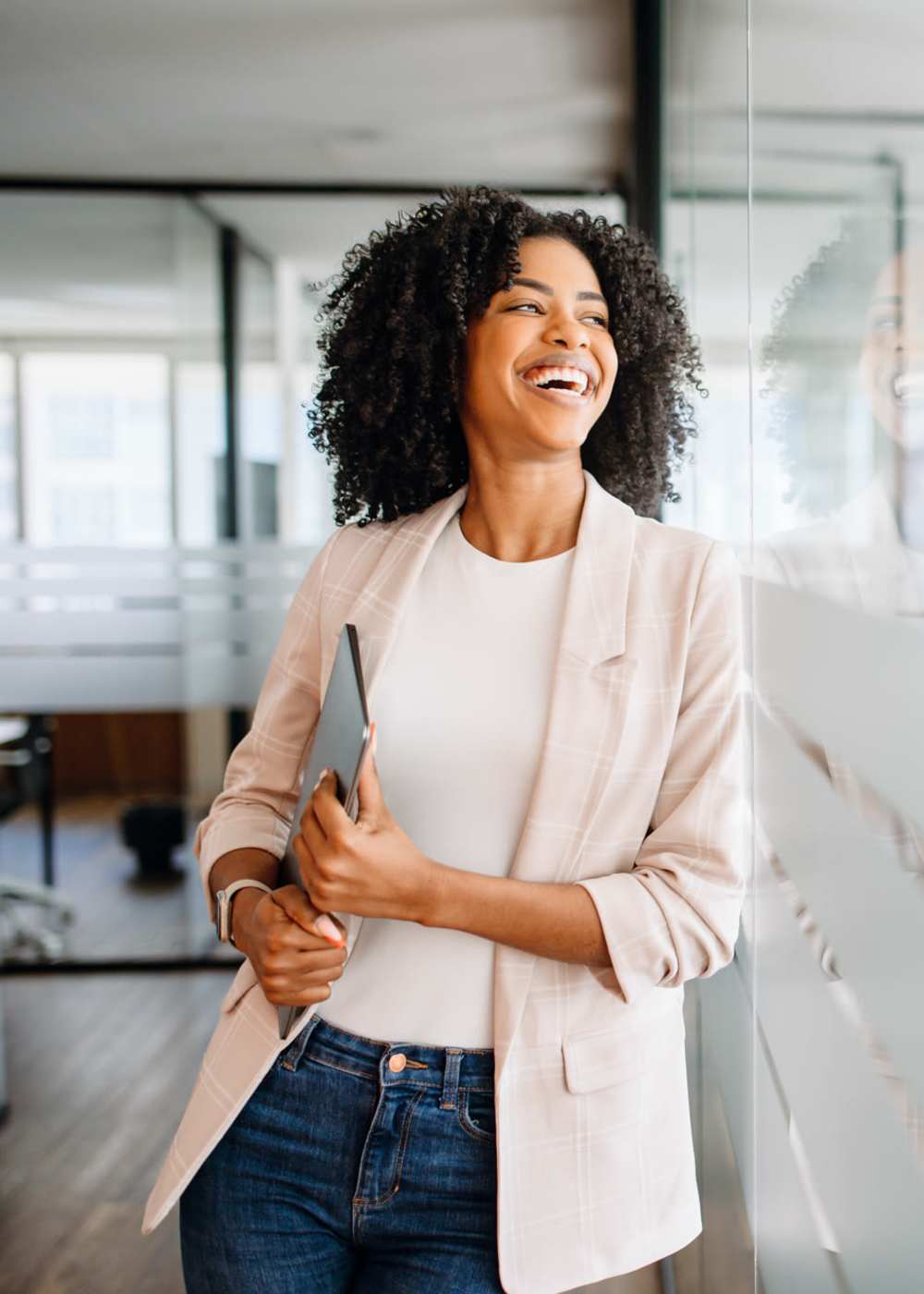 A resident student carrying her laptop near Haven Hills in Vancouver, Washington 