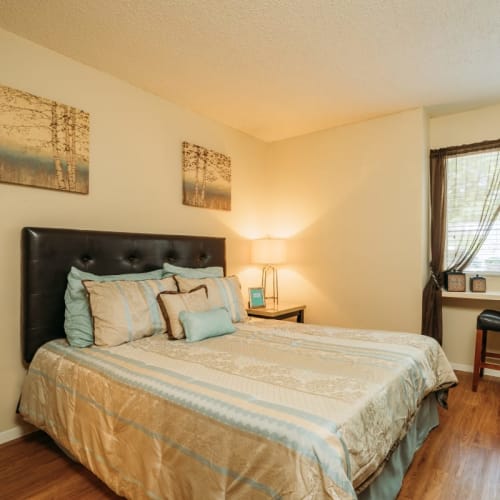 Bedroom with hardwood floors at Park Vista Apartments in San Antonio, Texas