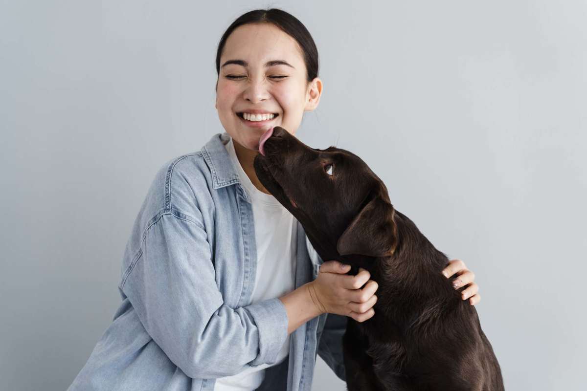 Resident playing with her dog at Avalon Park in Brownfield, Texas 