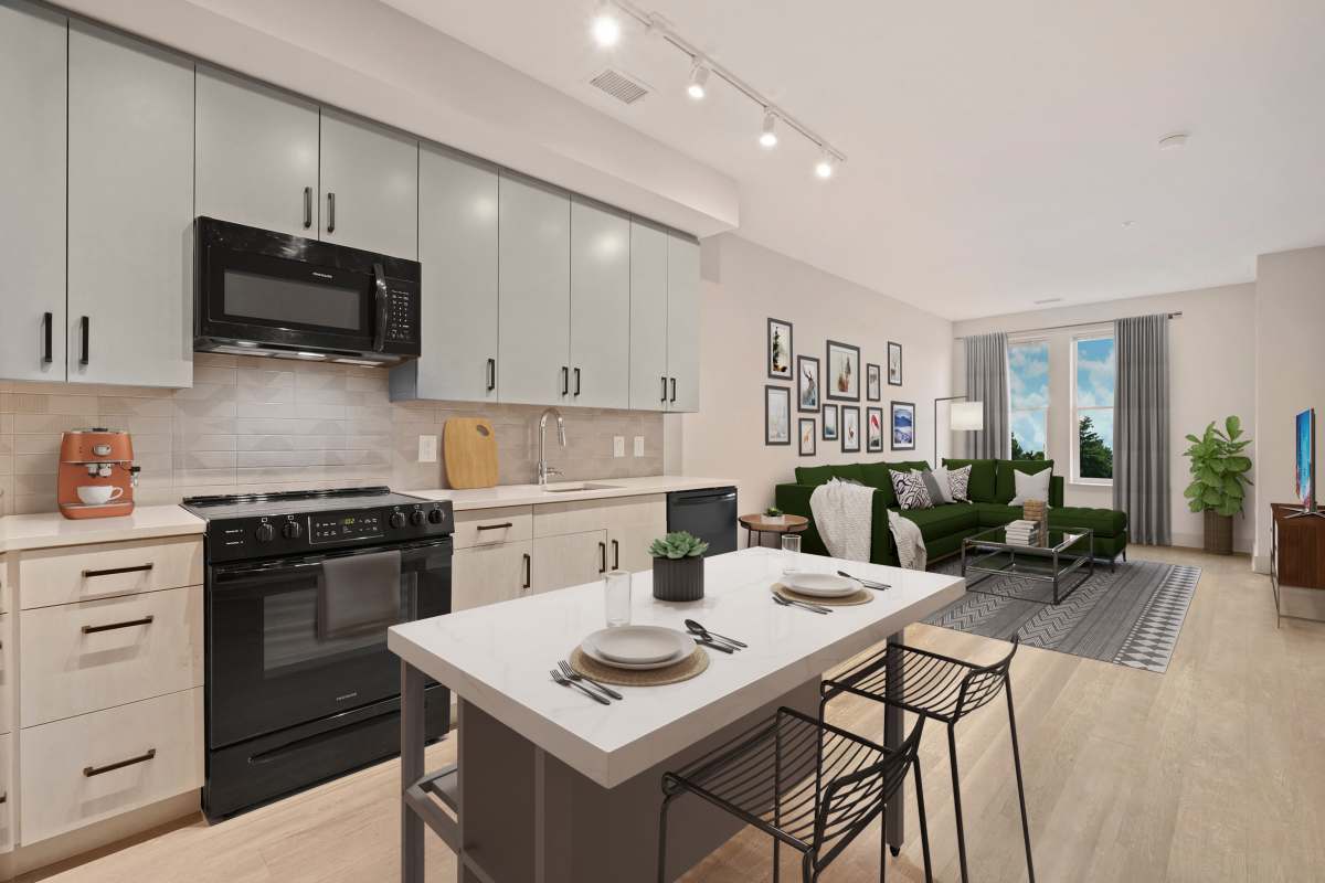 Very spacious and open kitchen with black appliances and two-tone cabinets at Big Sky Flats in Washington, District of Columbia