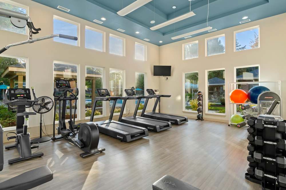 Fitness center with plenty of workout stations at Cortland Village Apartment Homes in Hillsboro, Oregon