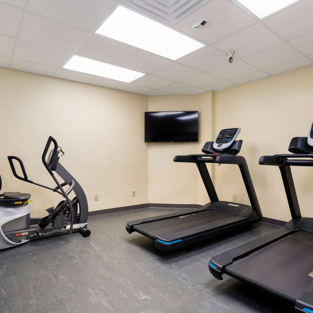 Fitness center with cardio equipment at Casa Panorama in Panorama City, California