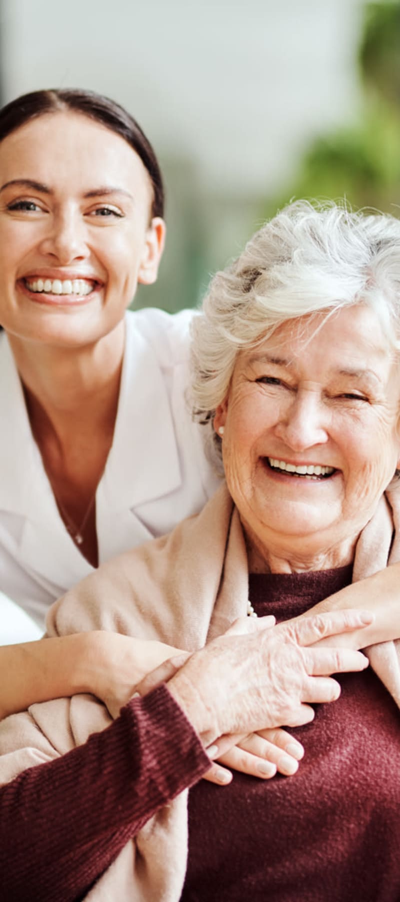 Resident and nurse hugging at Retirement Ranch in Clovis, New Mexico