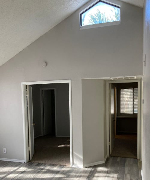 Model bedroom with hardwood floors at Park Vista Apartments in San Antonio, Texas