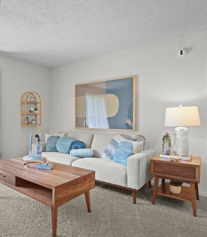 Spacious living room with large windows at Country Hollow in Tulsa, Oklahoma