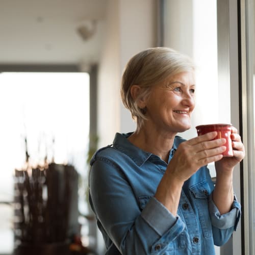 A resident having her coffee at Bonita Bluffs in San Diego, California