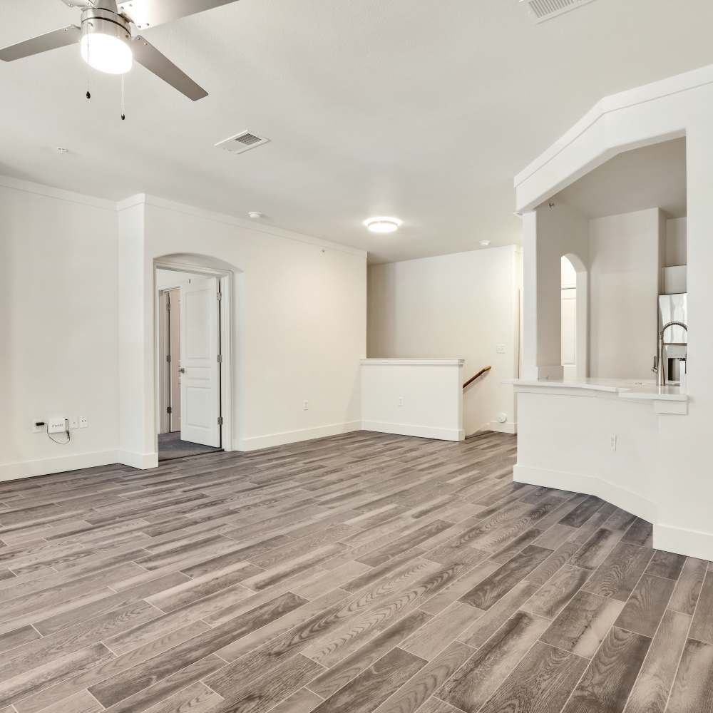 Unfunished living room with wooden flooring at The Berkeley in Fort Worth, Texas
