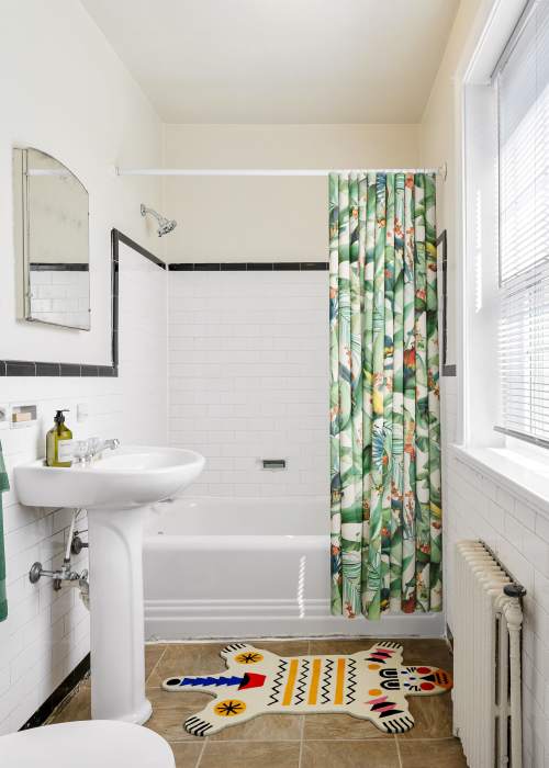 A decorated apartment bathroom at 1005 Grove Ave Apartments in Richmond, Virginia