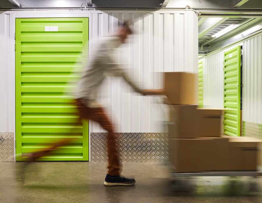 Guy pushing a cart at Storage Hub - Redland in San Antonio, Texas 