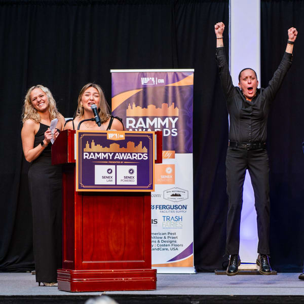 A group of employees at a black tie award ceremony recognizing Landmark Property Services, Inc. in Richmond, Virginia