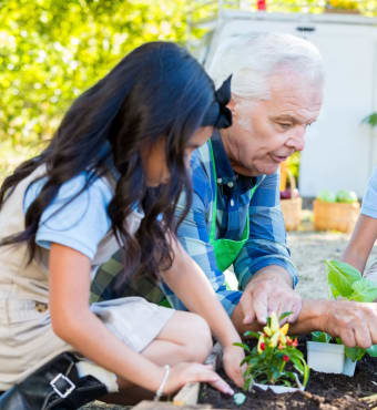 Resident and their grandchild playing at The Pointe at Summit Hills in Bakersfield, California