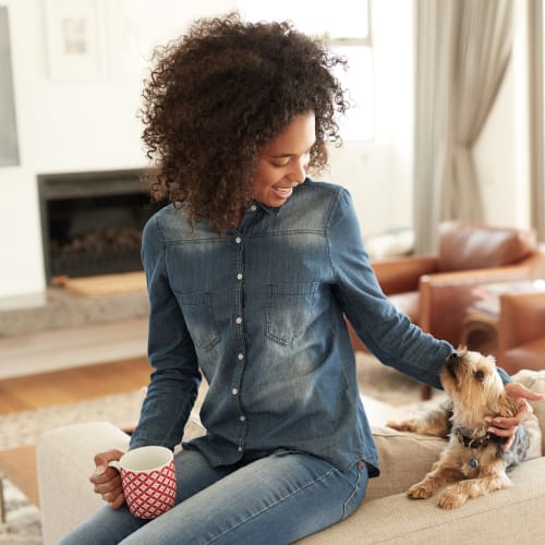 A resident playing with her dog at Breezy Point in Norfolk, Virginia