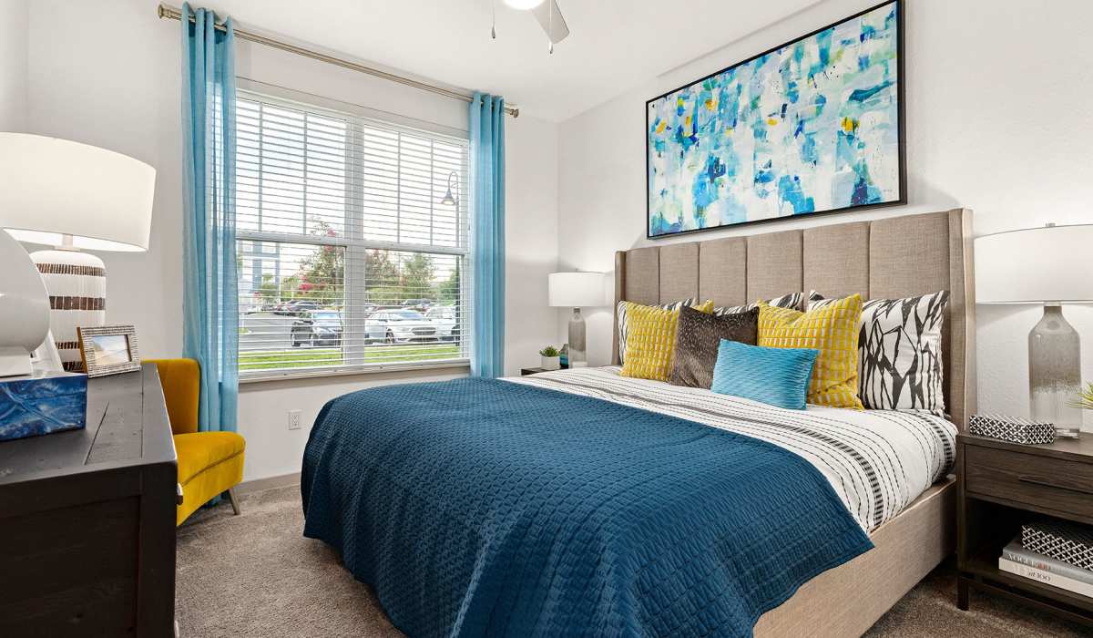 Spacious bedroom with window and ceiling fan at Vue on Lake Monroe in Sanford, Florida