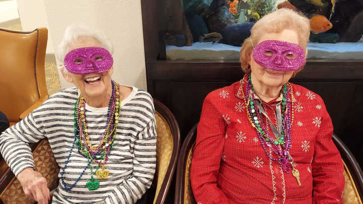 Festive fun at The Landing at Shadow Creek! Residents celebrate Mardi Gras with masks, beads, and joyful moments together.