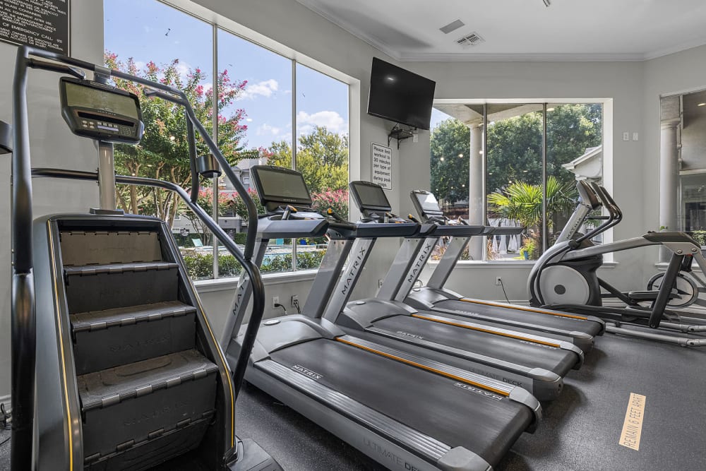 Cardio machines with large windows at Marquis at Stonegate in Fort Worth, Texas