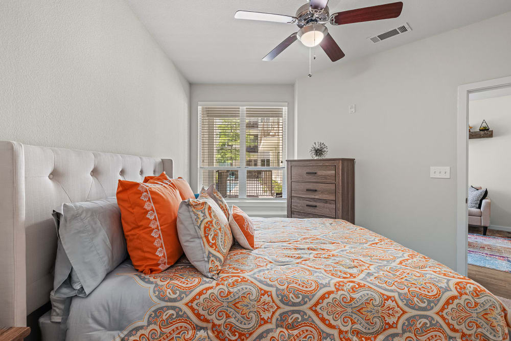 Spacious bedroom with a ceiling fan at The Marq on West 7th in Fort Worth, Texas