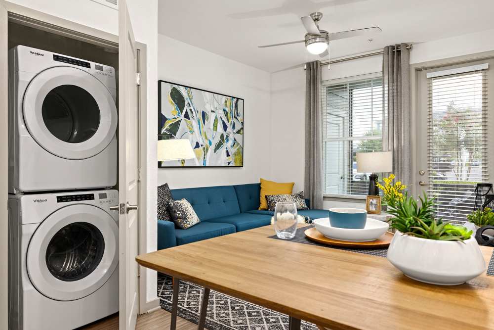 Apartment kitchen with in unit washer and dryer at Vue on Lake Monroe in Sanford, Florida