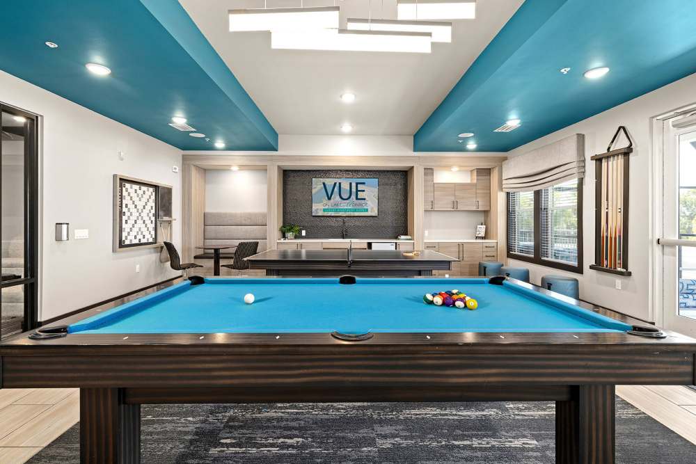 Trendy community game room with pool table at Vue on Lake Monroe in Sanford, Florida
