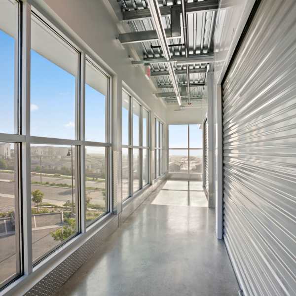 Indoor storage units with red doors at StorQuest Self Storage in El Cajon, California