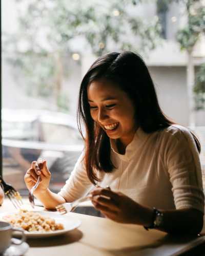 Resident having delicious food at a restaurant near Northchase Village in Houston, Texas