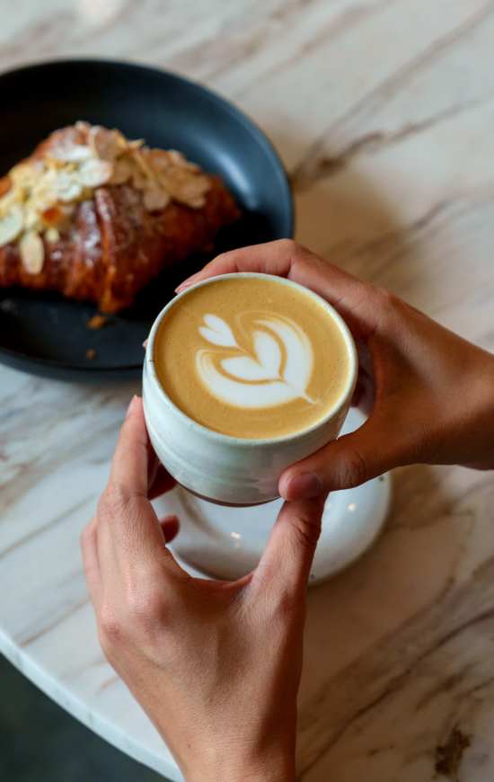 Drinking coffee at The Den in Columbia, Missouri