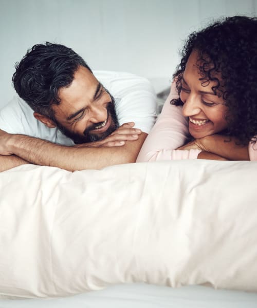 Residents laying on their bed at Landmark Apartments Phase II in Little Rock, Arkansas