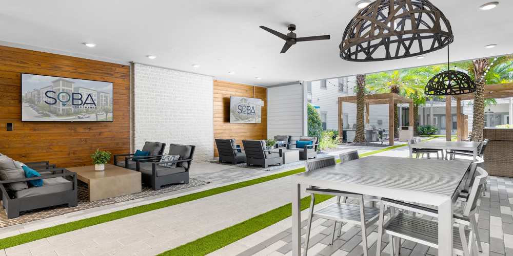 Community game room with large television at SoBA Apartments in Jacksonville, Florida