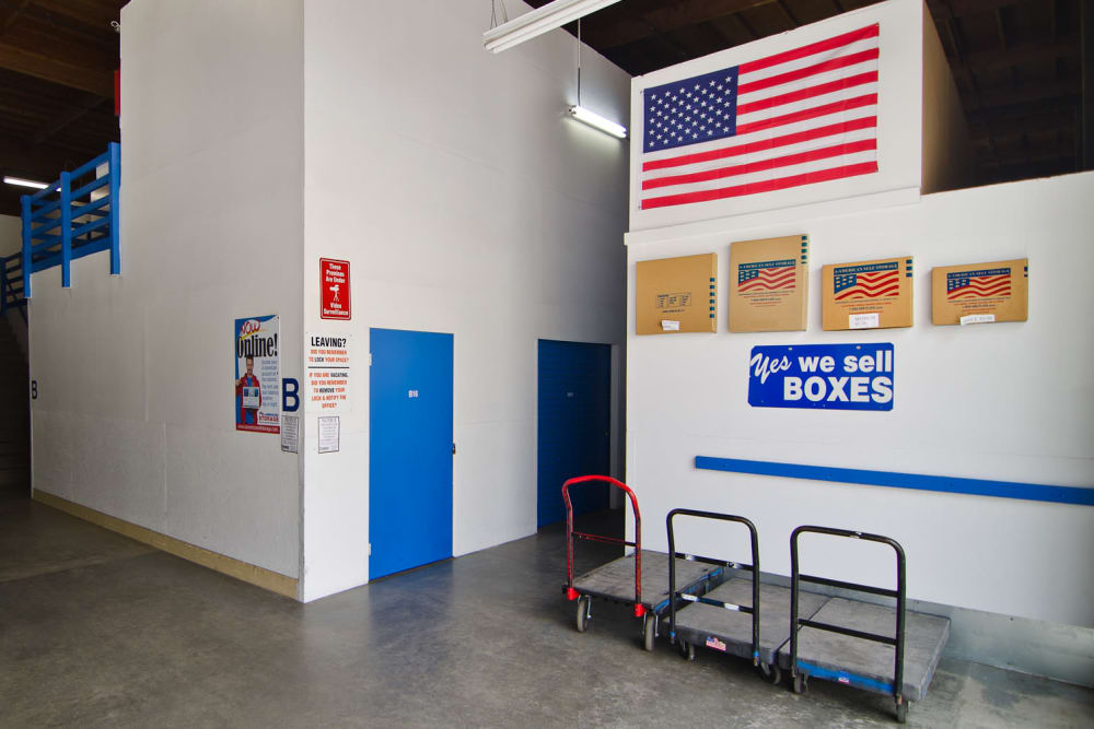 Entryway with carts and packing supplies available at A-American Self Storage in Santa Barbara, California