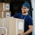 customer holding a box at Chenal Storage Center in Little Rock, Arkansas