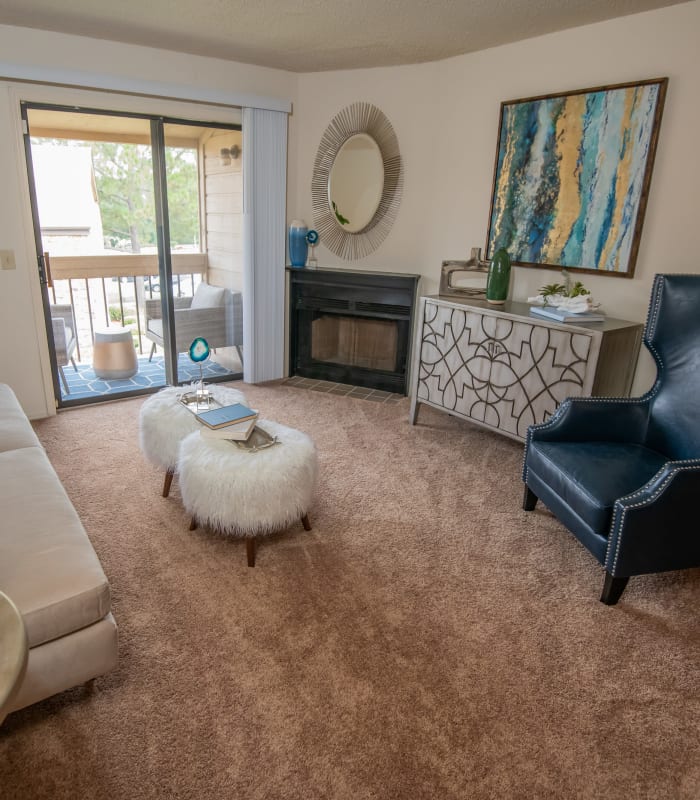 Carpeted living room at Sunchase Ridgeland Apartments in Ridgeland, Mississippi