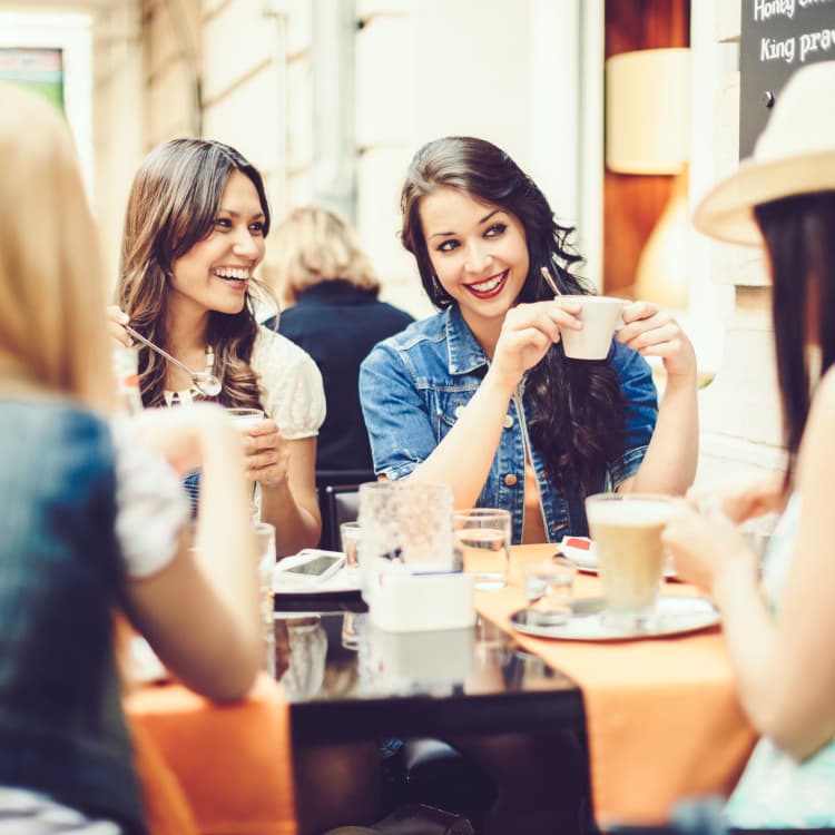 Group of women enjoying a cup of coffee at Pompton Gardens